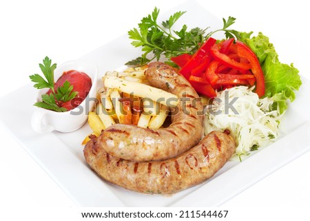 grilled sausages with French fries, sauerkraut and sweet pepper on a plate on a white background