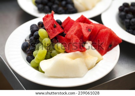 fruit plate of watermelon melon grapes green blue