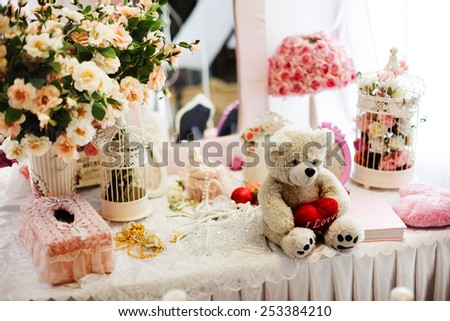 Cute teddy bear with a heart in pink still life in the style of Provence with flowers