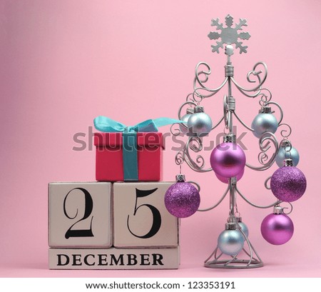 Pastel pink and blue theme Mark the Date calendar for Christmas, December 25, with festive decorations.