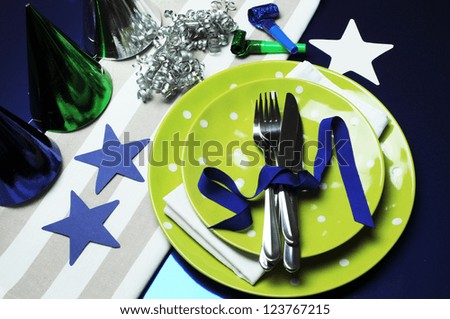 Football celebration party table in team colors decorations of blue, grey, green and white.
