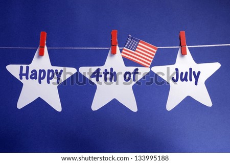 Happy Fourth 4th of July message written across three 3 white stars with USA American flag hanging on red pegs on a line against a blue background.