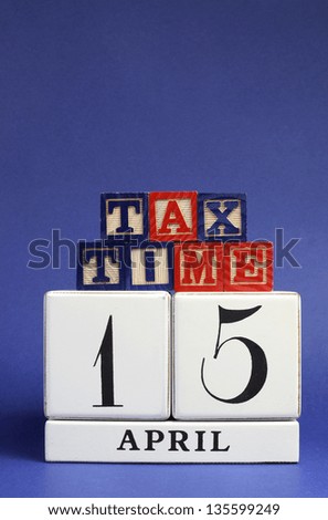 April 15 calendar date with Tax Time message on building blocks for Tax Day reminder. Vertical with copy space for your text here.