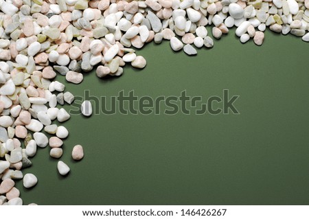 Pink, white and green pebbles gravel background abstract, with copy space for your text here.