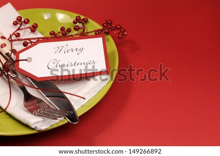 Modern trend lime green and red Merry Christmas table place setting, with copy space for your text here.