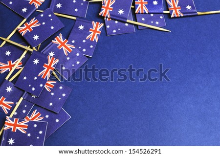 Australian flags abstract background, with red white and blue Southern Cross flags against a dark blue background, with copy space for your text here.