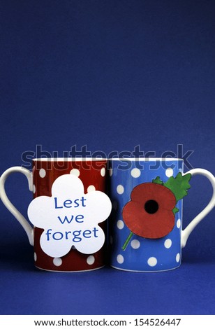 Commemorate November 11, Remembrance Day, Armistice Day, with red, blue and white them coffee tea cup mugs with Lest We Forget message and Flanders red poppy icon.