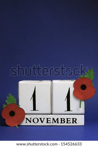 Save the Date, white block calendar, for November 11, Remembrance Day, Red Poppy Day, or Armistice Day holiday, with red Flanders Poppies against a dark blue background. Vertical with copy space.