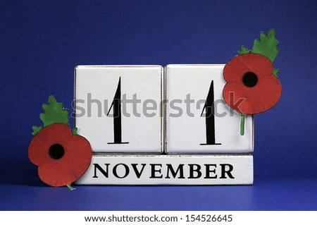 Save the Date, white block calendar, for November 11, Remembrance Day, Red Poppy Day, or Armistice Day holiday, with red Flanders Poppies against a dark blue background.