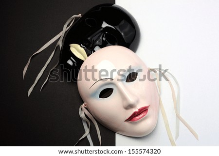 Black and white theme ceramic masks for Mardi Gras, acting, performance or theater concept.
