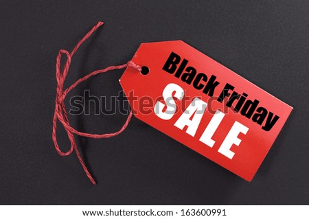 Black Friday Shopping Sale Concept With Red Ticket Sale Tag Close Up On Black Background.