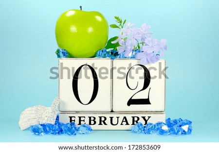 Save the Date vintage shabby chic block calendar with winter theme fruit and flowers on pale blue background, for birthdays, events, weddings, holidays or website events, for February 2