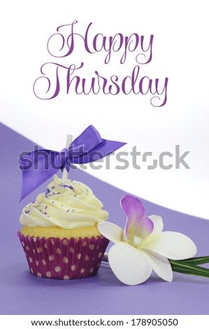 Purple theme cupcake with orchid flower with Happy Thursday sample text or copy space for your text here.