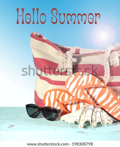Summer vacation holiday gear with red and white strip beach bag, flip flop things, shell and sunglasses on a aqua blue table against a blue sunny sky with sample text or copy space..