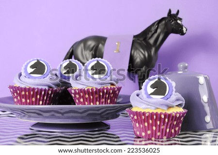 Black and white chevron with purple theme party luncheon table place setting for Melbourne Cup, Australian public holiday, horse race event cupcakes against purple background.