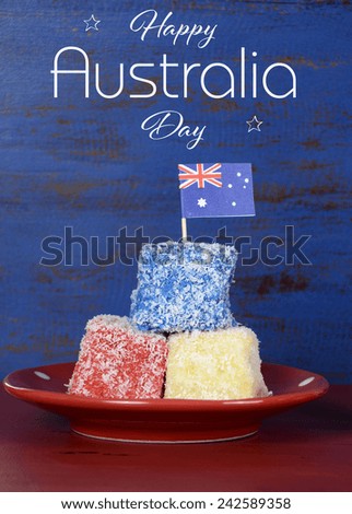 Happy Australia Day red, white and blue lamingtons on red and blue dark recycled wood background.