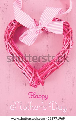 Happy Mothers Day gift of pink cane heart shape wreath with sample text, and applied retro vintage style filters.