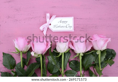 Happy Mothers Day Pink Roses on Vintage style distressed pink wood table with gift tag.