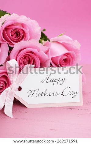 Happy Mothers Day Pink Roses on Vintage style distressed pink wood table.