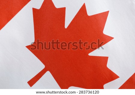 Canadian red and white maple leaf flag for Canada Day, July 1, celebration and national holidays, closeup.
