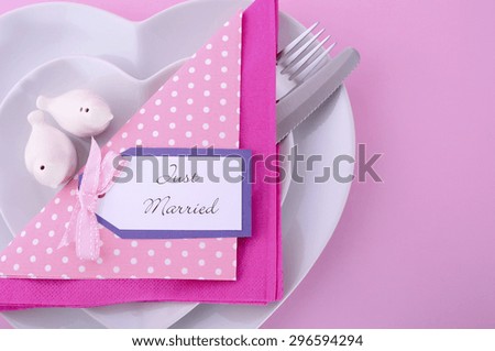 Modern Wedding Table Place Setting with Heart Shape Plates on Pink Table Background.