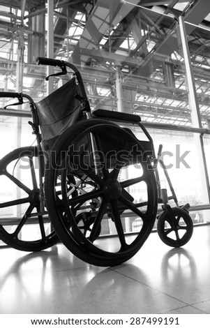 Black and white Wheelchair service in airport terminal