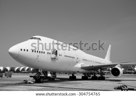 black and white Airplane near the terminal in an airport cockpit
