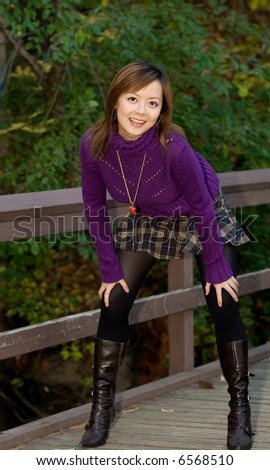 a cheerful lady in small bridge of Garden