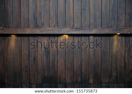 Ray lights on antique wooden wall