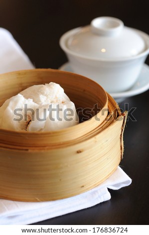 Type of Chinese Steamed Bun with tea cup.