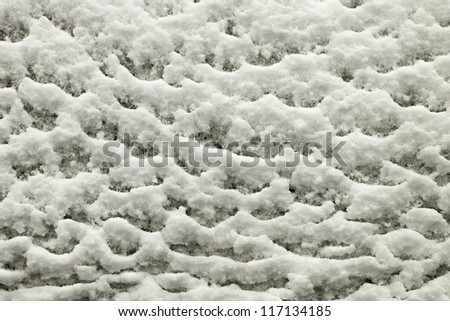 Pretty wavy pattern formed by falling winter snow