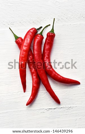 Bunch of colorful red hot chili peppers used as a pungent flavoring and spice in cooking