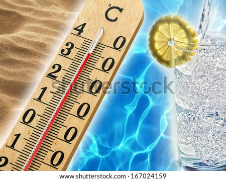 Hot summer days in the tropics with beach sand, a thermometer showing thirty degree temperatures and cool inviting blue water alongside a refreshing iced beverage