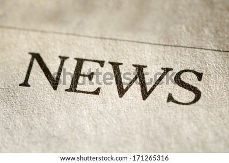 Close up view of the printed typed header for News on textured paper of a newspaper or journal