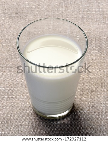 Glass of rich creamy cows milk for a healthy refreshment in a tumbler