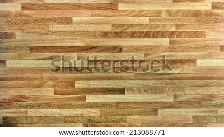 Background texture and pattern of parallel lines of natural wooden boards in interior decor forming a floor or wall cladding with a wood grain texture