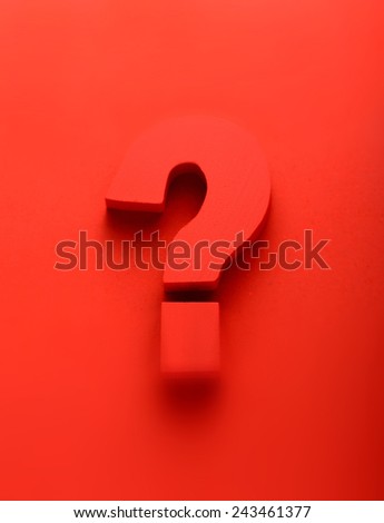 Red question mark on a red background in a conceptual image of a question, query, problem, interrogative, solution, search and answer