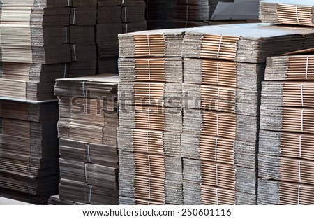 Close up Shot of Plenty Piles of Unused Card Boards Inside the Factory.