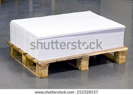 Pile of Empty White Documents on Top of Paper Pallet on the Floor.