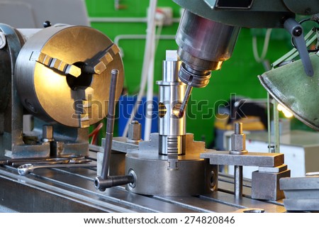 Close Up of Drilling Machine Demonstrating Precision During Manufacturing of Machine Parts