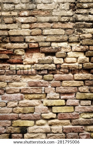 Architectural Detail of Old Brick Wall with Bricks of Varying Size and Color, A Weathered Wall with Missing Bricks, for Backgrounds