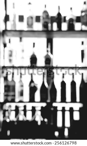 blurred alcohol bottles photo background, black and white