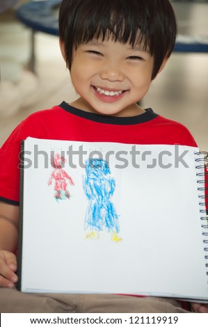 Boy is proudly to present his painting which mom painted in blue and he's red.