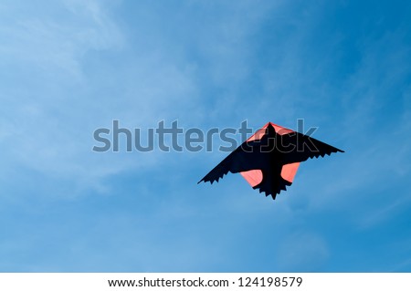 A bird shape kite with blue sky background.