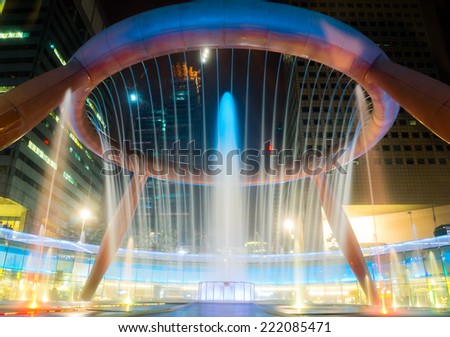 SINGAPORE - AUG 24: Colorful fountain show on August 24, 2014 in Singapore. Fountain of Wealth at Suntec Tower is the most attractive landmark for tourism at Singapore.