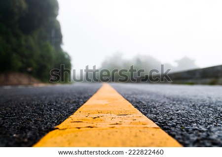 Close up of asphalt road with nature background, shallow focused
