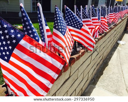 Row of American flags displayed on the street in celebration of Independence Day