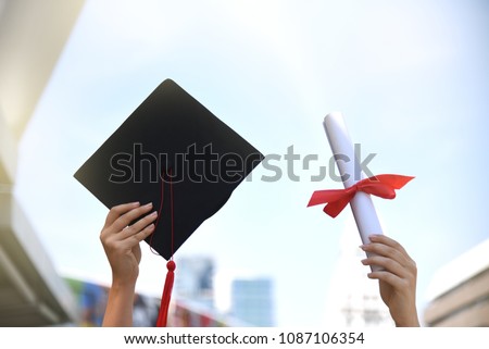 Graduation student learner is finish education school university degree and get diploma and mortarboard she raise hand up to the blue sky showing her proud using for copy space or background