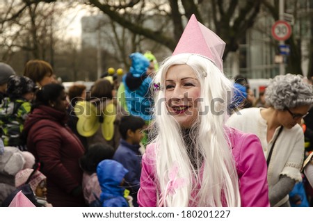 DUSSELDORF, GERMANY - MAR 1, 2014 People at a carnival parade called Youth procession or Jungendumzug in Dusseldorf, Germany. This event that takes place every year.