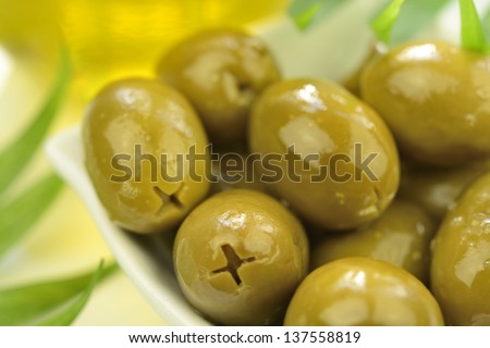 Stuffed green olives and olive oil macro (horizontal)